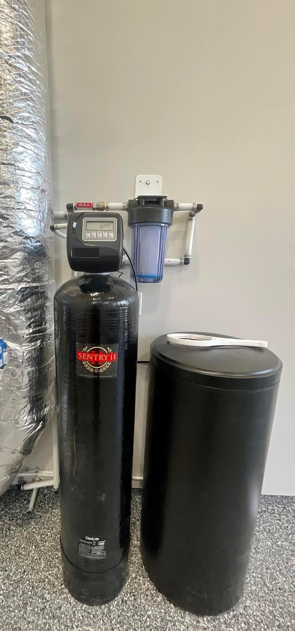 Water treatment equipment plumbed into a residential supply line